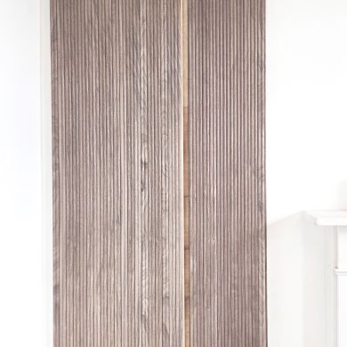 01-handleless-walnut-wardrobe-invisible-storage-cladding-london