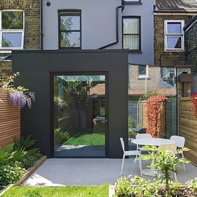 01-contemporary-rear-extension-pivot door-frameless-glazing-black-metal cladding
